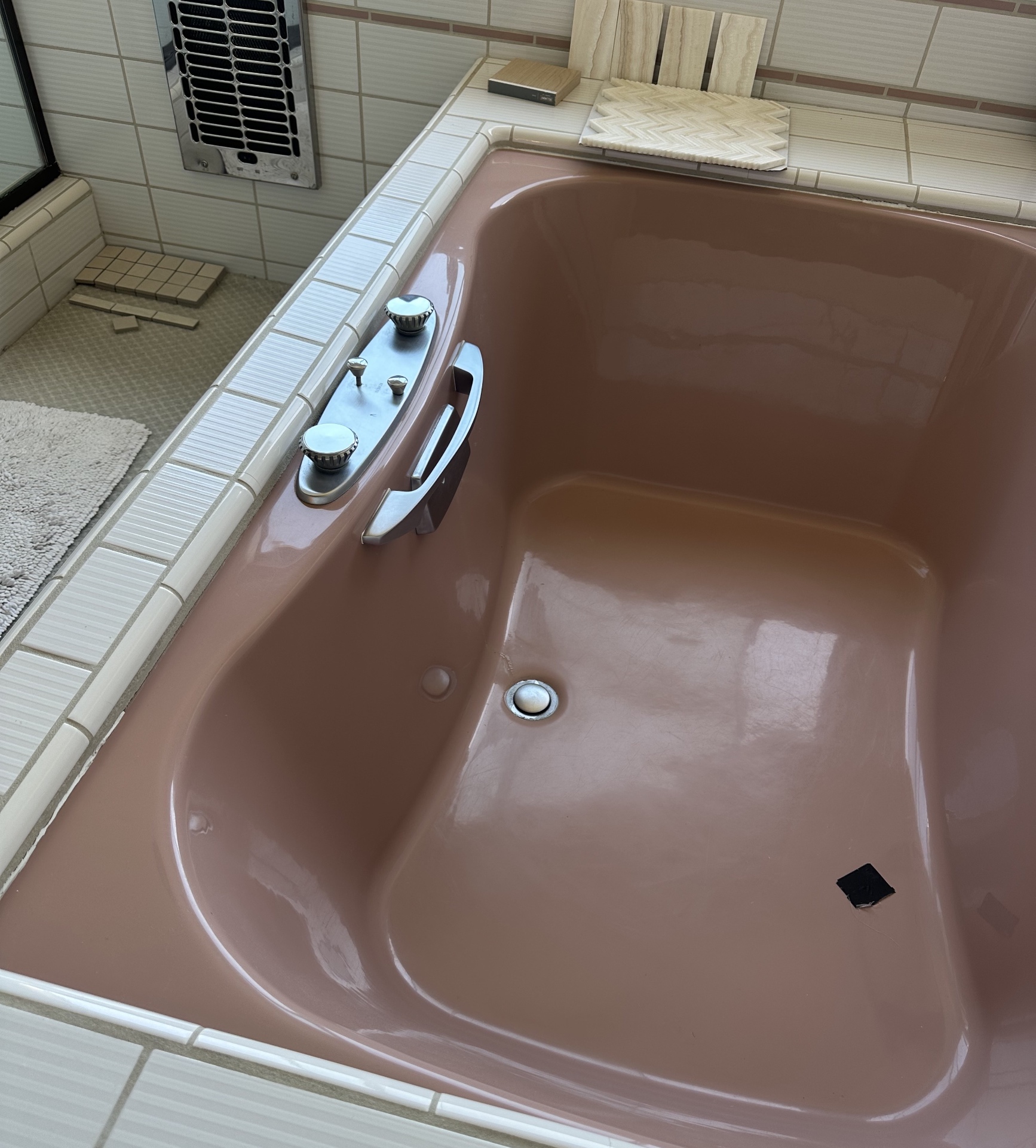 BEFORE: Dated pink soaking tub